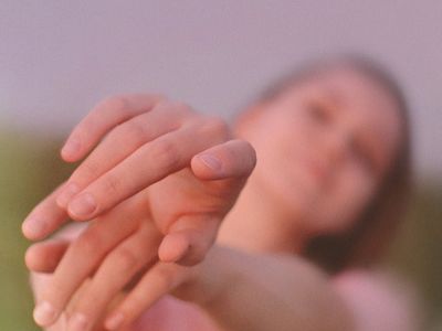 Blurred motion of a person during stretching.